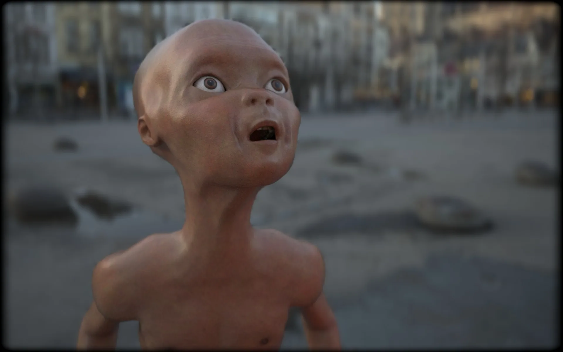 Close-up of the alien's face: a bald head with large eyes and an open mouth, looking up, with a blurred street behind.