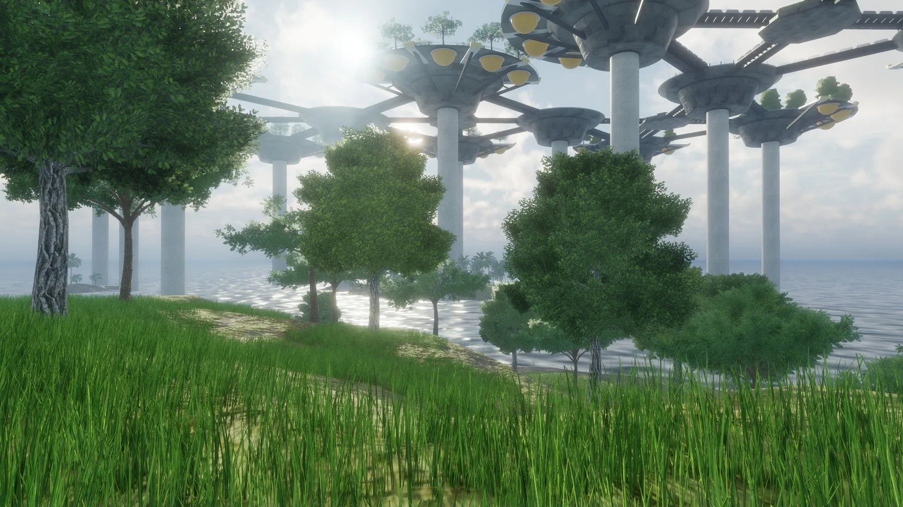 Green trees on a grassy shore, with round platforms on pillars rising behind in hazy sun.